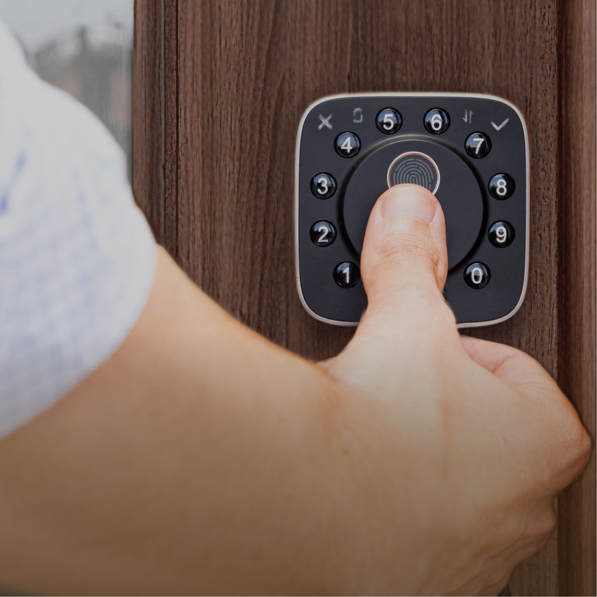 
Person unlocking a ULTRALOQ smart lock using fingerprint recognition for fast keyless entry
