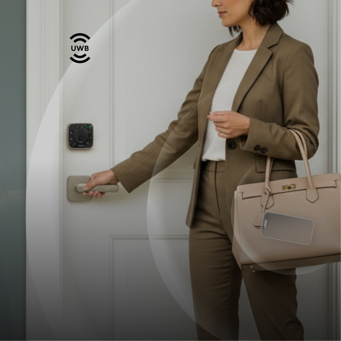 
Person approaching a ULTRALOQ UWB smart lock with hands-free automatic unlocking technology
