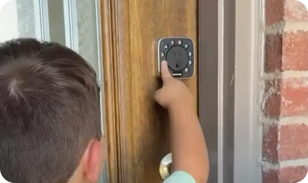
Child unlocking a ULTRALOQ smart lock using fingerprint access
