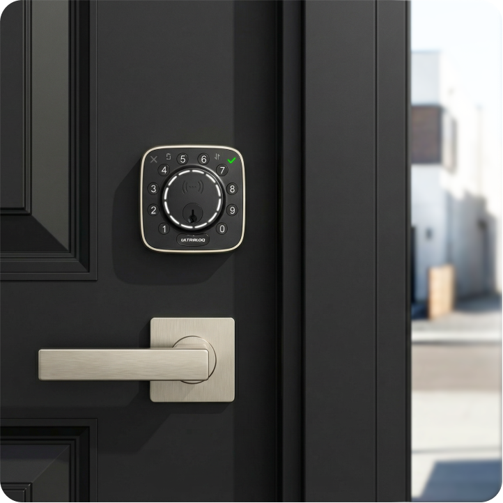 ULTRALOQ Bolt Mission smart deadbolt with silver door handle installed on a black front door
