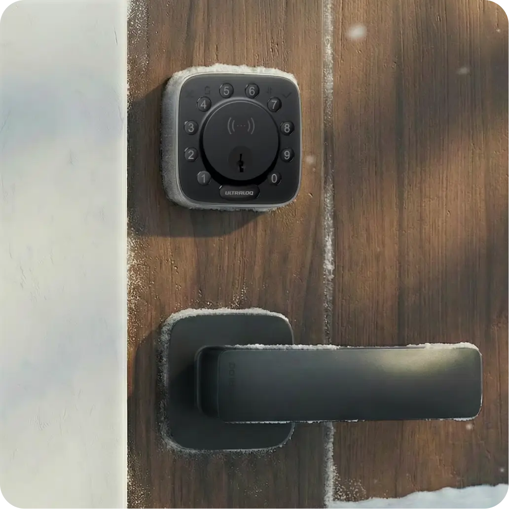 
Smart lock installed on a wooden front door with a modern black door handle
